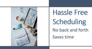 A person holding a book and a scheduler open on the table